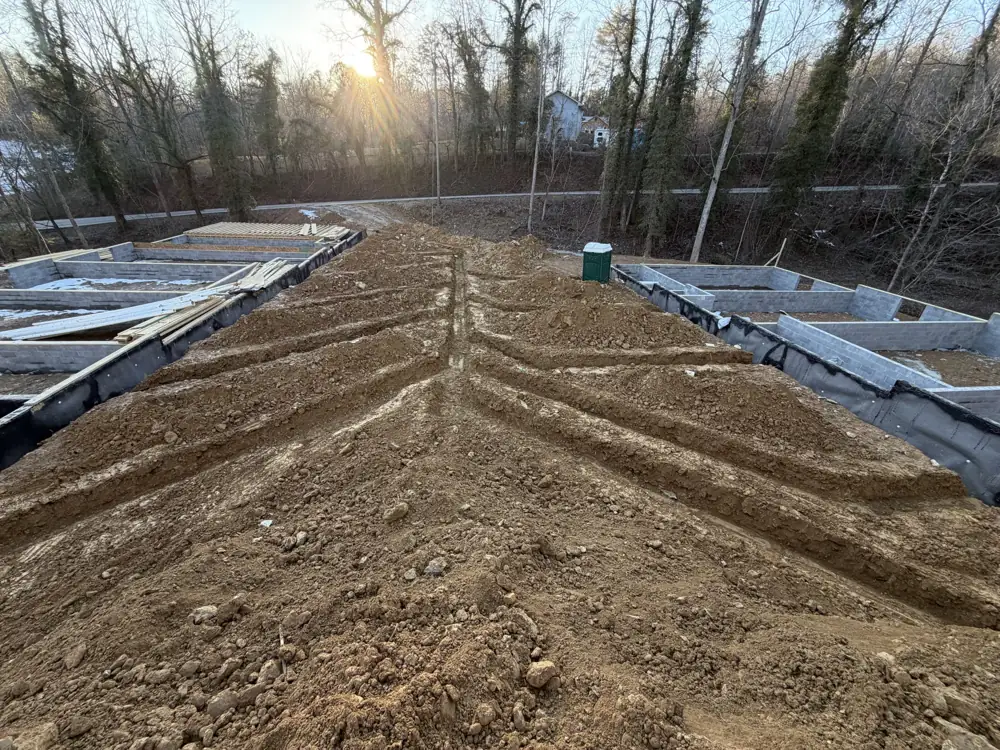 Foundation footings excavated and formed at dusk on a Blount County, TN build site