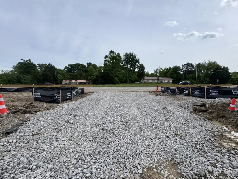 Gravel commercial pad prepared beside a roadway