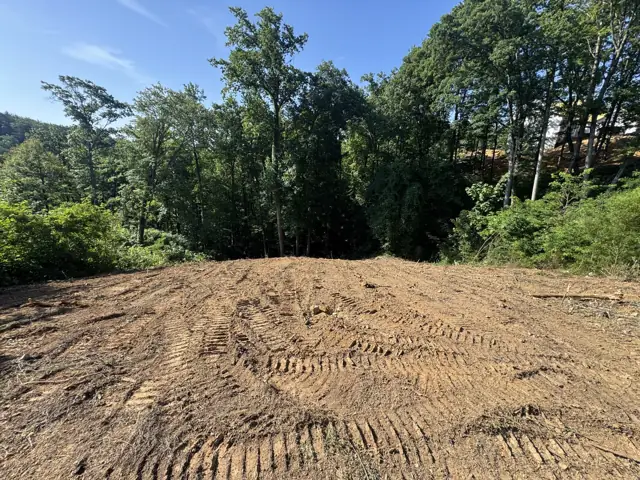 Graded building pad with tire tracks