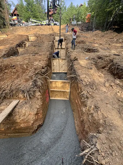 Footing pour with forms in a trench