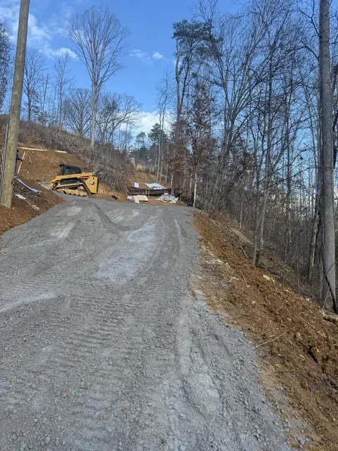 Gravel drive cut into a hillside