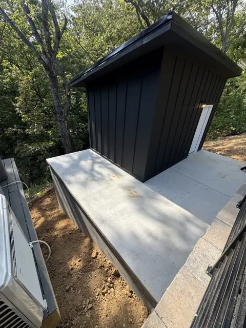 Small outbuilding on a concrete slab
