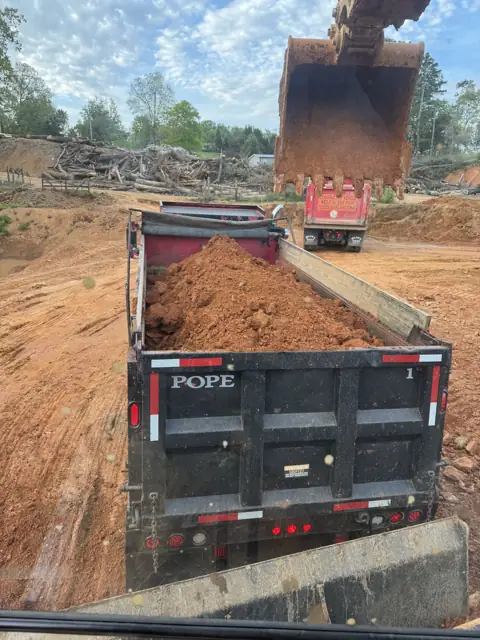 Excavator loading a dump truck