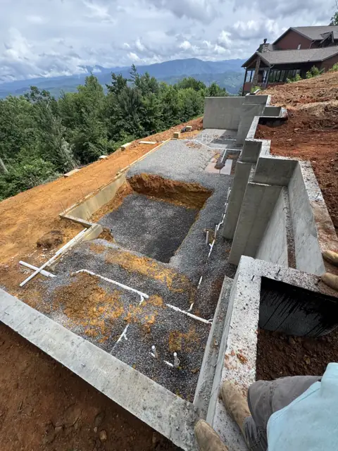 Poured concrete foundation walls with plumbing stubs