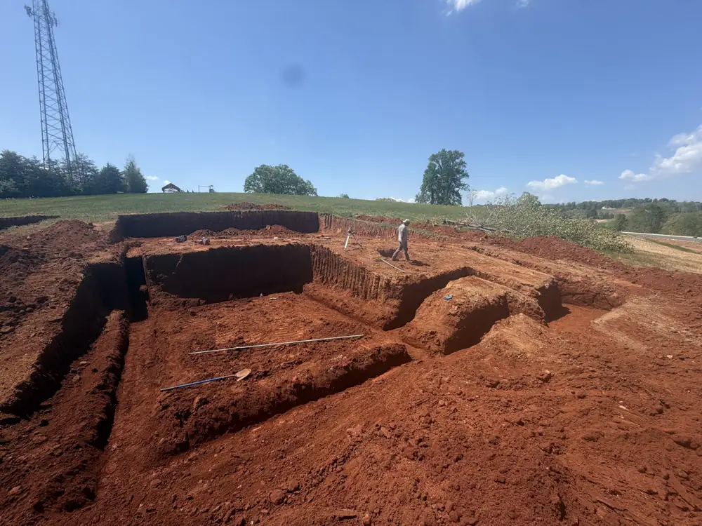 Large foundation excavation in red clay soil in Jefferson County, TN