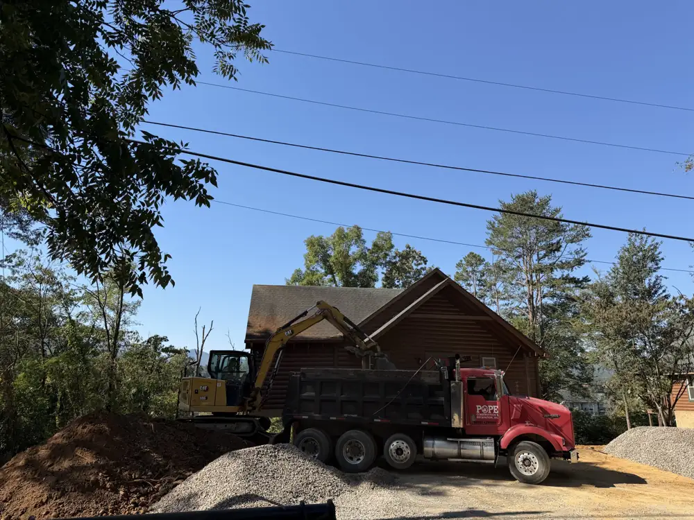 Dump truck hauling at a residential building site near Sevierville, TN