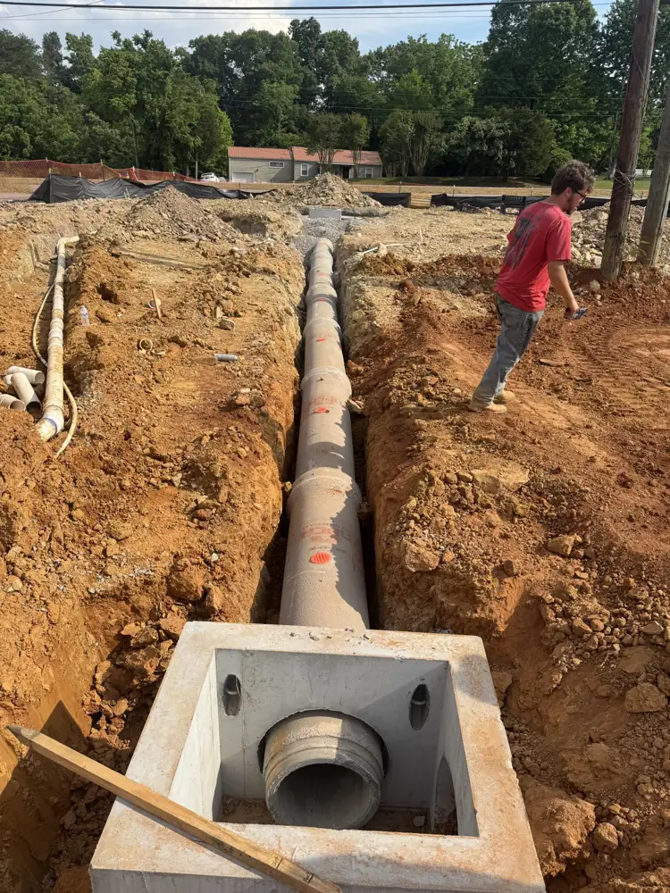 Storm drain structure and pipe set in an open trench